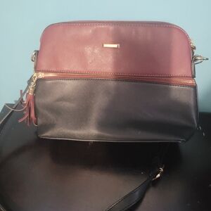 Two-Tone Burgundy and Black Crossbody Bag with Tassel Accent